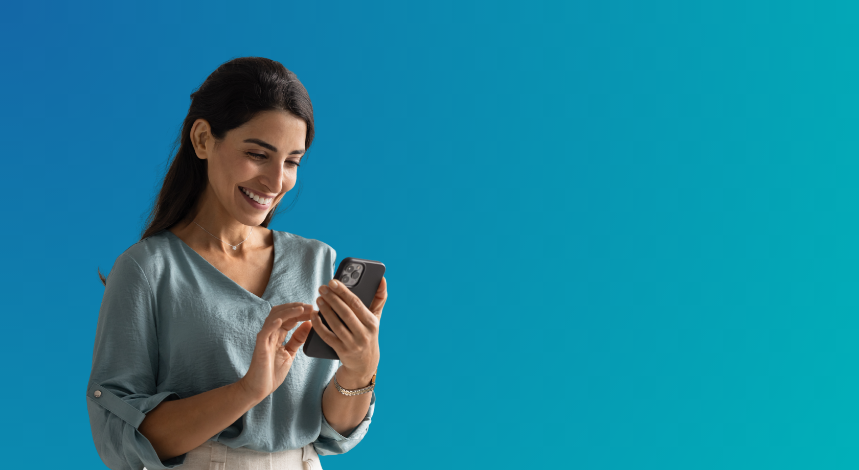 Woman using a smartphone to explore Achieve Financial Credit Union's new online loan experience.