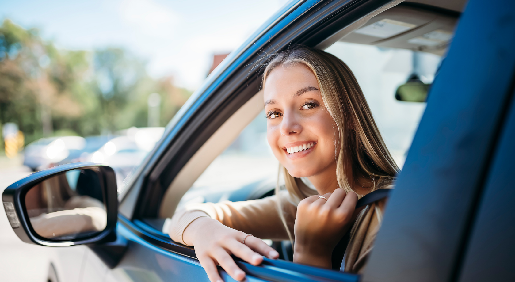 Member smiling inside vehicle